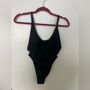 Black high leg and scoop back one piece